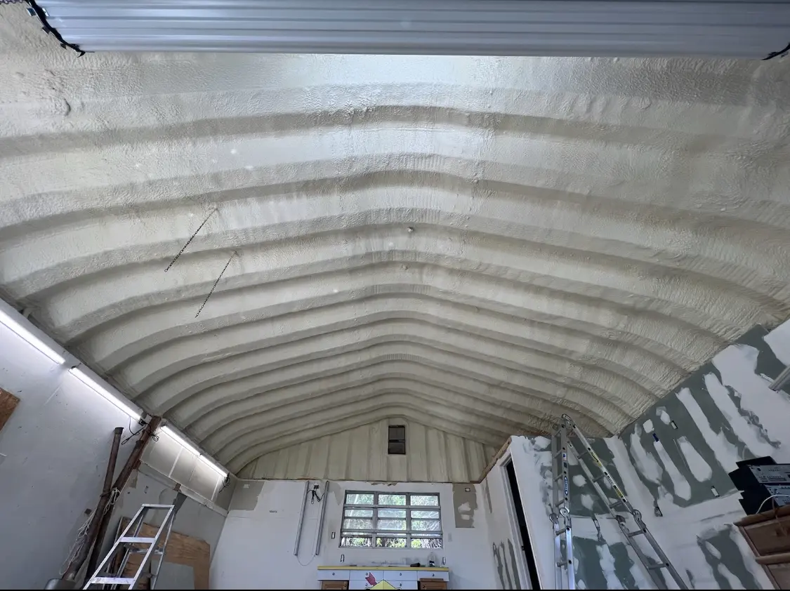 Spray polyurethane foam applied to the underside of a metal roof deck in Meadville